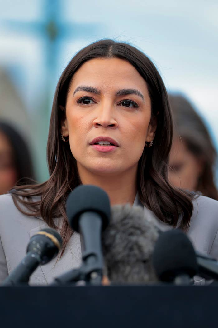 alexandria ocasio cortez speaking at press conference.jpg