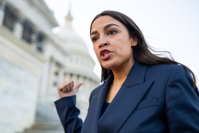 aoc gesturing outside us capitol building.jpg