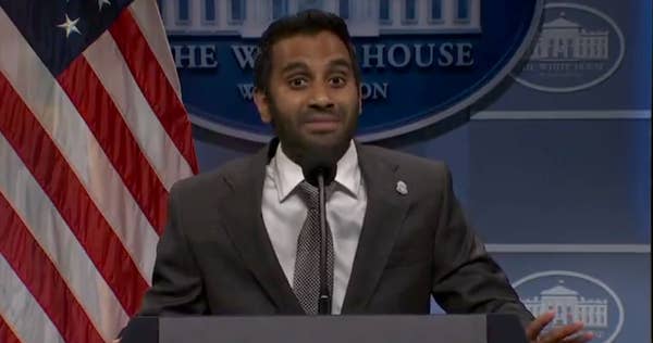aziz ansari speaking at white house podium.jpg