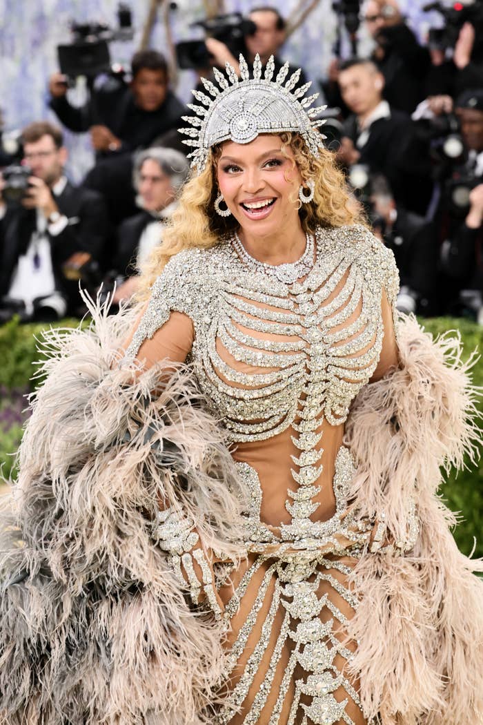 beyonce full look skeleton gown feather cape met gala