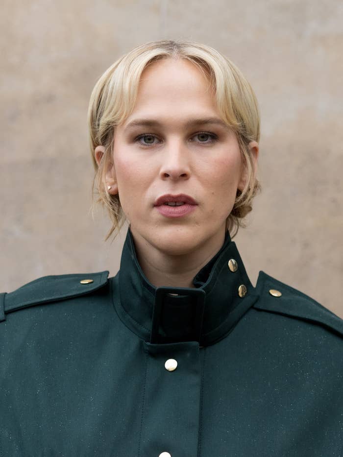 blonde woman green military style coat.jpg