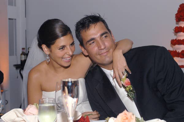 bride and groom smiling at wedding reception