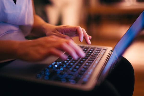 close up hands typing on laptop keyboard.jpg