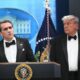 donald trump and man in tuxedos white house podium
