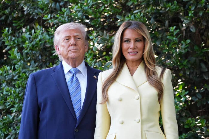 donald trump melania trump standing outdoors