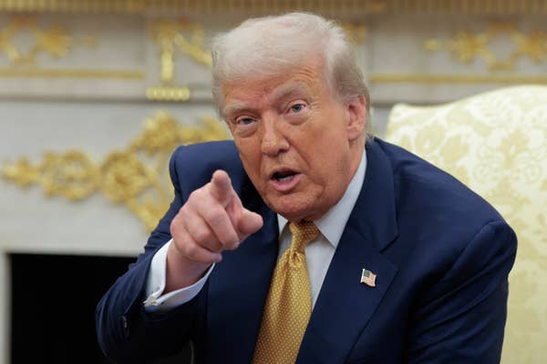 donald trump pointing finger blue suit.jpg