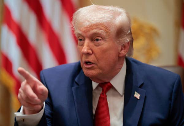 donald trump speaking american flag background.jpg