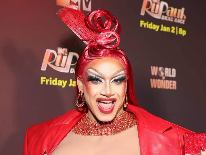 drag performer red hair rupaul red carpet