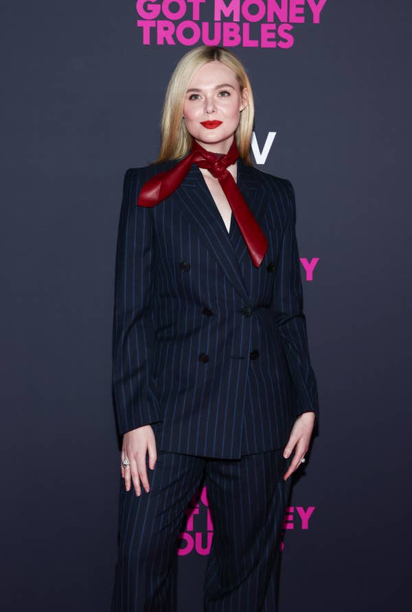 elle fanning pinstripe suit red leather scarf