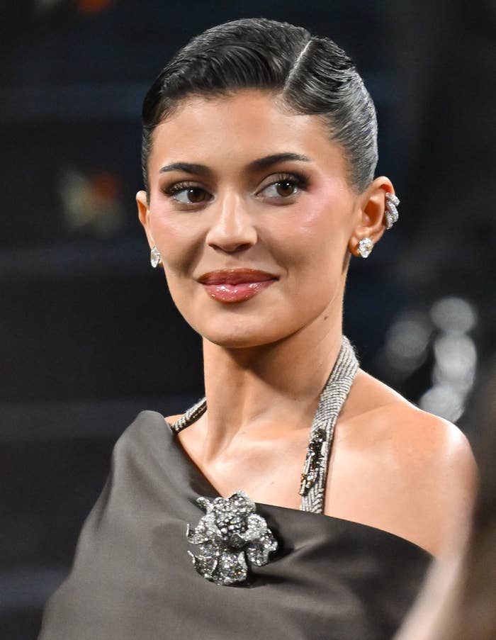 kylie jenner headshot slicked hair diamond earrings