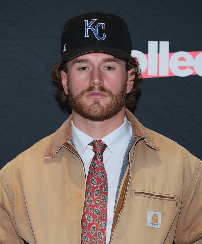 man in carhartt jacket with kc baseball cap