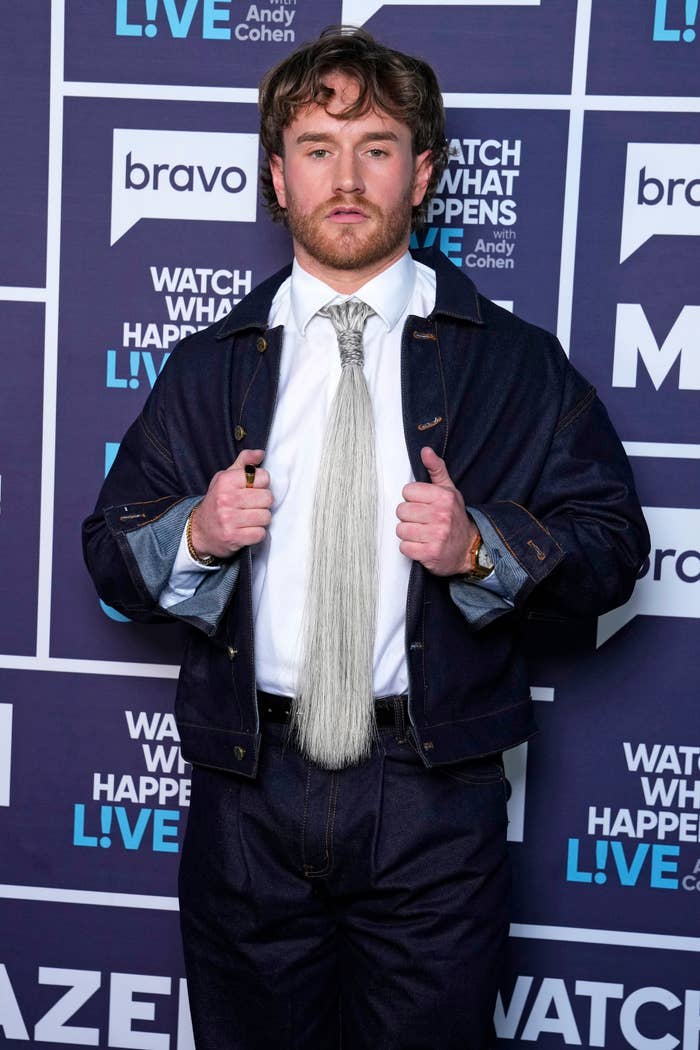 man in denim jacket and hair textured tie