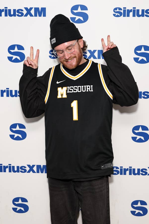 man in missouri tigers basketball jersey and beanie