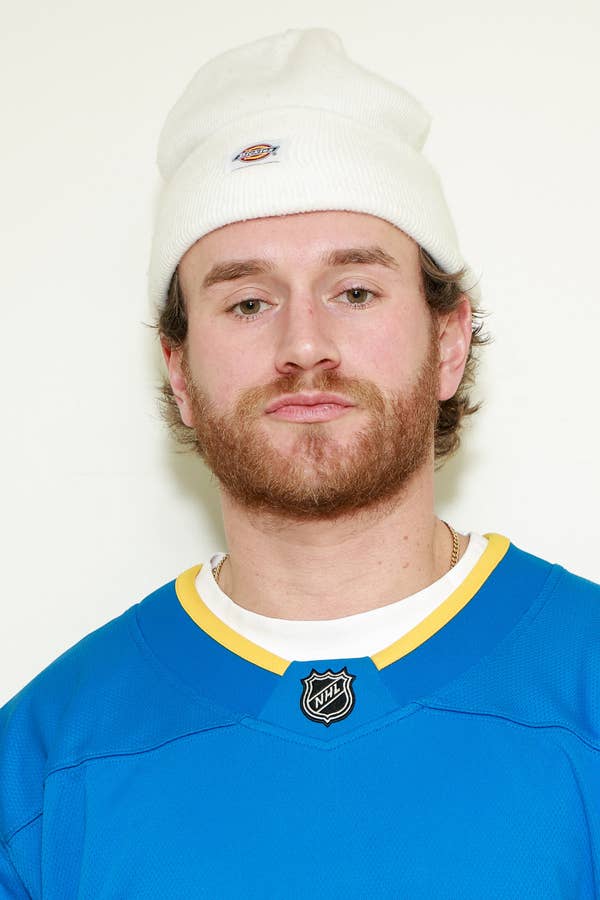 man wearing white dickies beanie and nhljersey.j