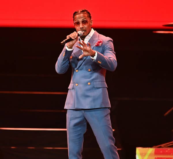 nick cannon blue double breasted suit singing.jpg
