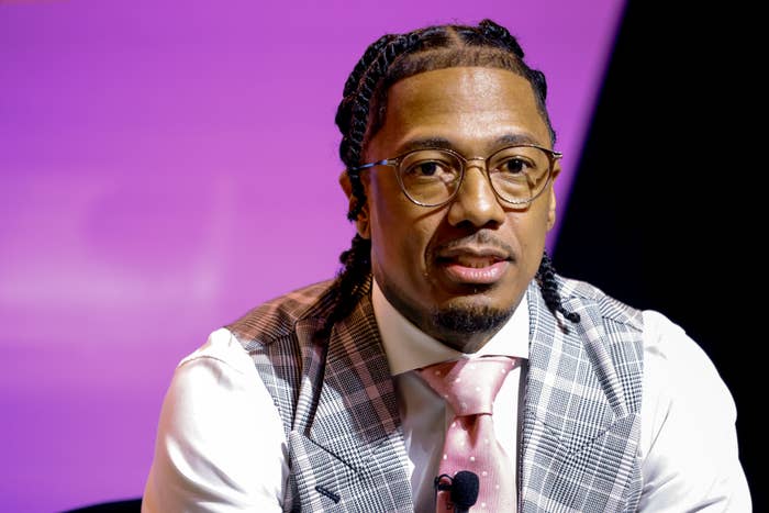 nick cannon braids plaid vest glasses.jpg