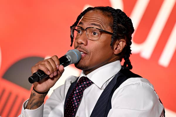 nick cannon interview microphone pinstripe vest.jpg