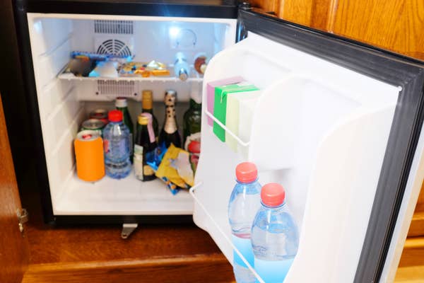open hotel minibar fridge with drinks.jpg