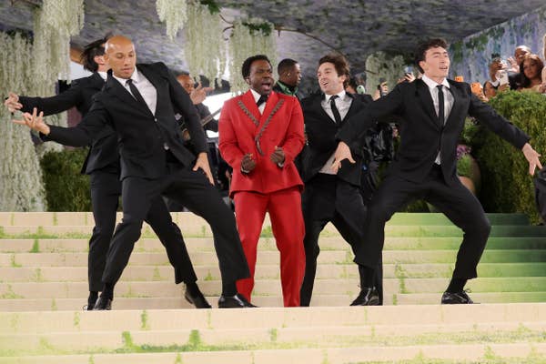 red carpet musical performance red suit dancers
