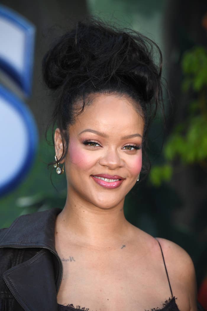 rihanna high bun hairstyle red blush makeup