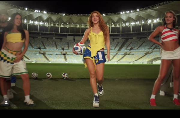 shakira holding soccer ball stadium