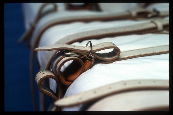 vintage medical restraint straps hospital bed